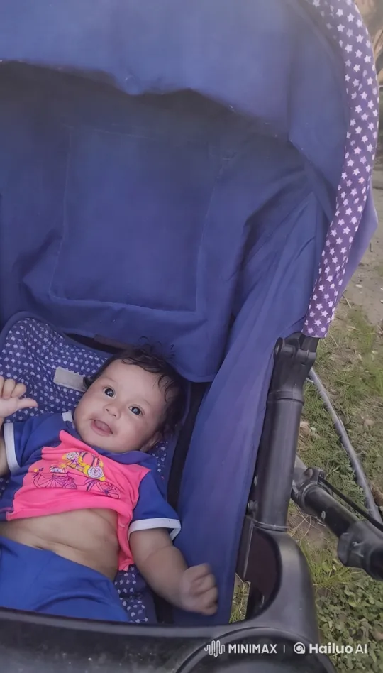Baby Dances Joyfully in Stroller with Colorful Outfit – AI Generated Video | Hailuo AI