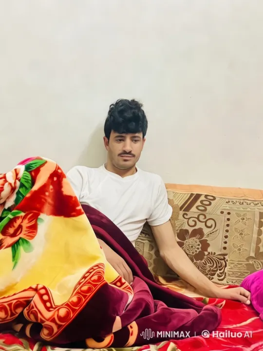Contemplative Smoking Scene with Floral Blanket – AI Generated Video | Hailuo AI