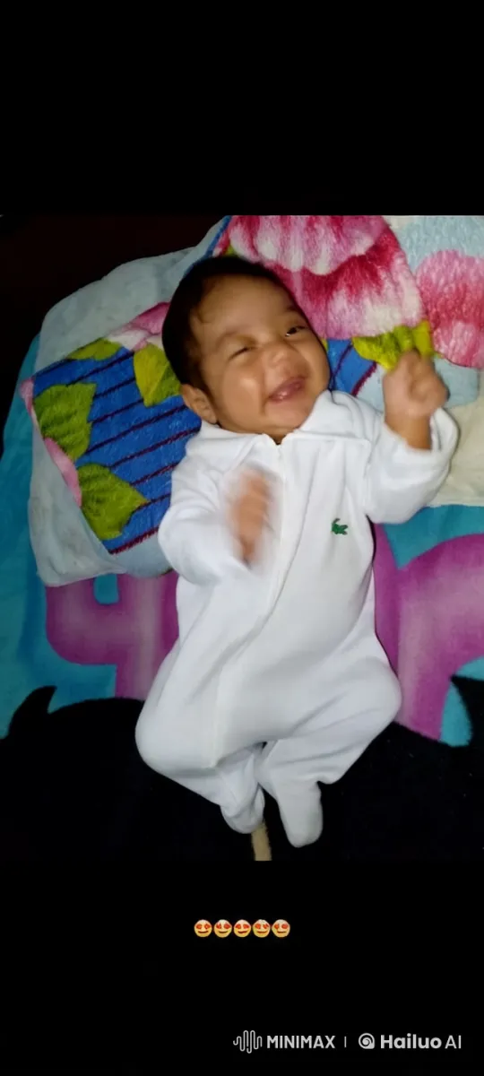 Peaceful Moment: Baby on Colorful Blanket – AI Generated Video | Hailuo AI