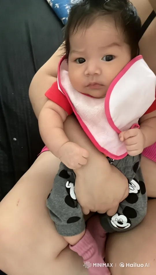 Baby Dances Joyfully on Lap in Cozy Setting – AI Generated Video | Hailuo AI