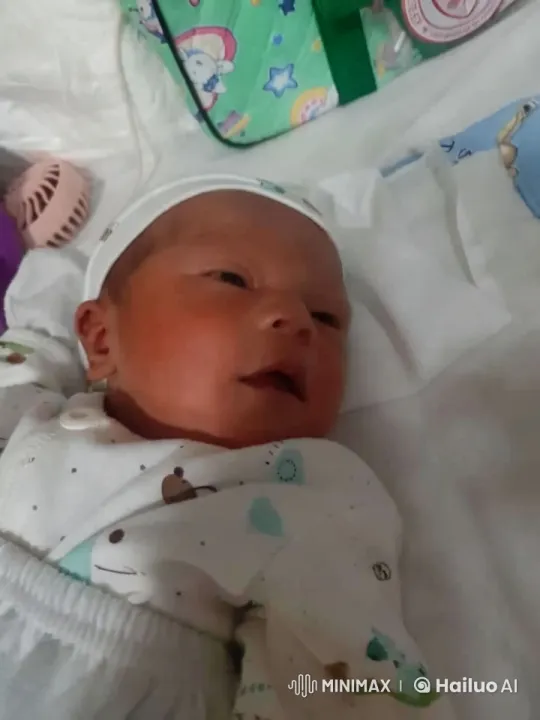 Serene Moment: Baby in Animal Onesie on Bed – AI Generated Video | Hailuo AI