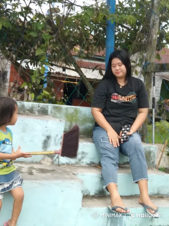 Woman and Child on Steps with Phone and Broom – AI Generated Video | Hailuo AI