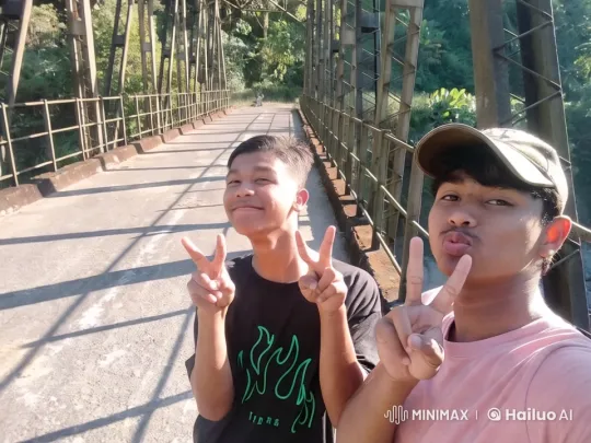 Two Men Smile on Rustic Bridge Amidst Greenery – AI Generated Video | Hailuo AI