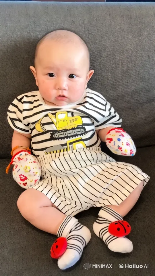 Baby Dancing in Striped Outfit on Couch – AI Generated Video | Hailuo AI