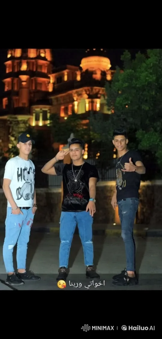 Three Young Men Pose Casually at Night Near Historic Building – AI Generated Video | Hailuo AI