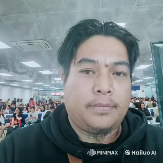 Close-up of a Person Blinking in a Crowded Waiting Room – AI Generated Video | Hailuo AI