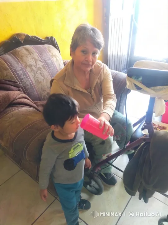 Elderly Woman Encourages Boy to Dance with Red Cup – AI Generated Video | Hailuo AI