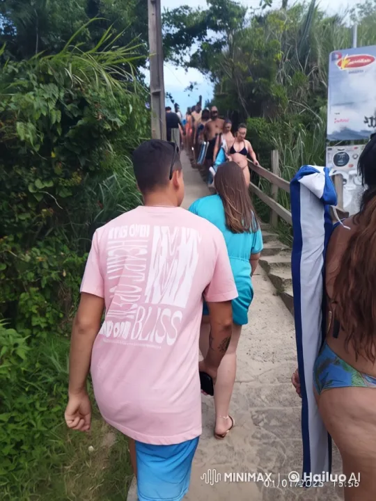 Crowd Hikes to Beach Amidst Lush Greenery – AI Generated Video | Hailuo AI