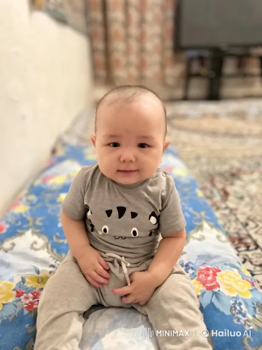 Baby Mimics Kungfu Moves on Floral Blanket – AI Generated Video | Hailuo AI