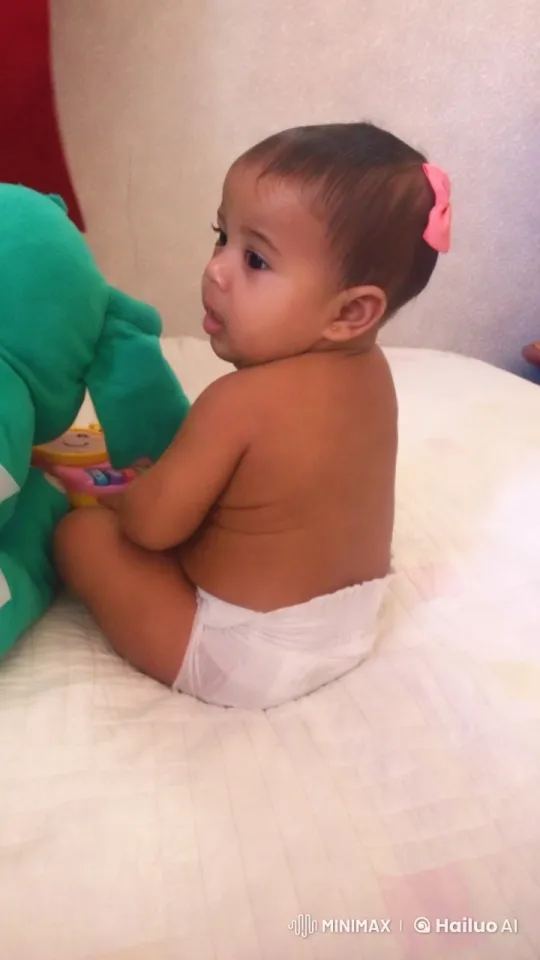 Baby Dancing with Toy on Bed - Heartwarming Video – AI Generated Video | Hailuo AI