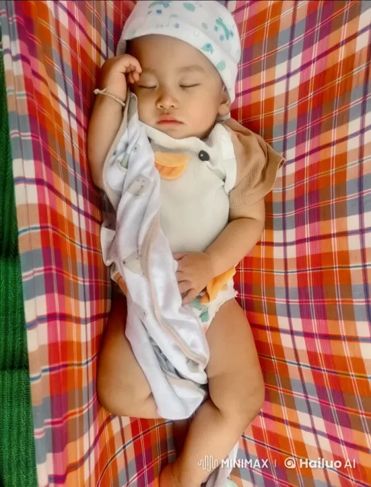 Baby Dancing Joyfully in Colorful Hammock – AI Generated Video | Hailuo AI