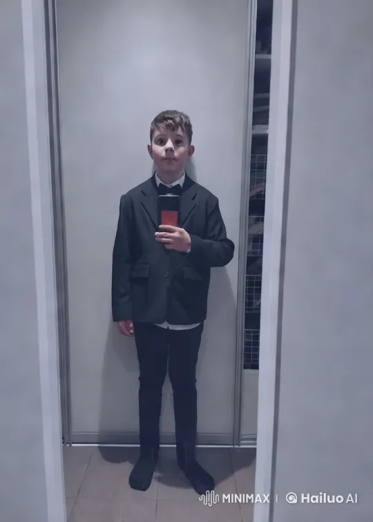 Formal Young Boy Preparing in Neat Room – AI Generated Video | Hailuo AI