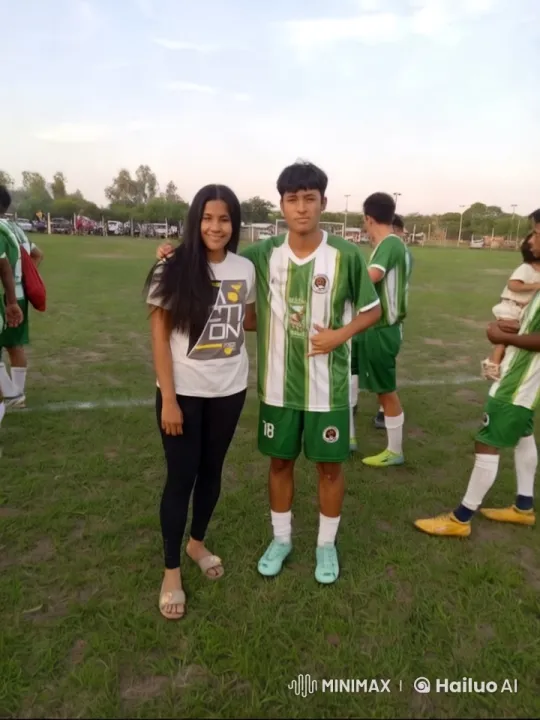 Football Field Friendship: Golden Hour Portrait – AI Generated Video | Hailuo AI