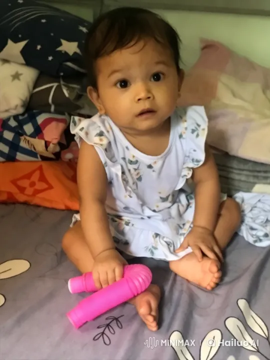 Baby's Joyful Dance in Colorful Bed Setting – AI Generated Video | Hailuo AI