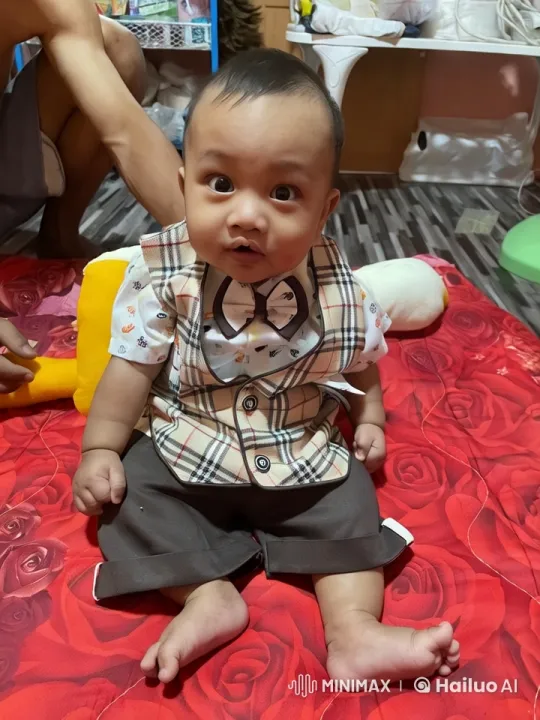 Baby Dancing Playfully on Colorful Blanket – AI Generated Video | Hailuo AI