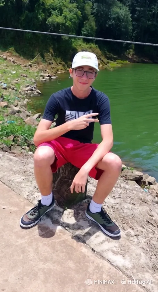 Young Man in Nature Amidst Serene Lake Landscape – AI Generated Video | Hailuo AI
