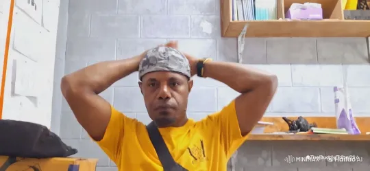 Dynamic Visuals: Man Adjusts Cap in Grey Concrete Room – AI Generated Video | Hailuo AI