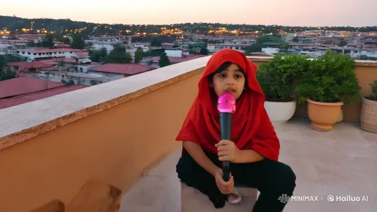 Boy in Red Headscarf Sings on Summer Terrace – AI Generated Video | Hailuo AI