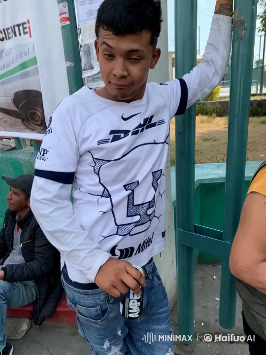 Young Man Dancing Energetically Against Fence – AI Generated Video | Hailuo AI
