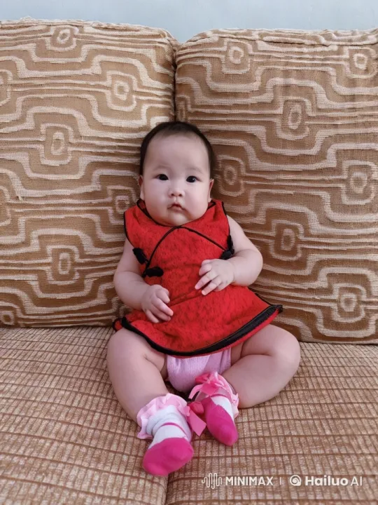 Baby Dancing on Couch in Vibrant Dress – AI Generated Video | Hailuo AI