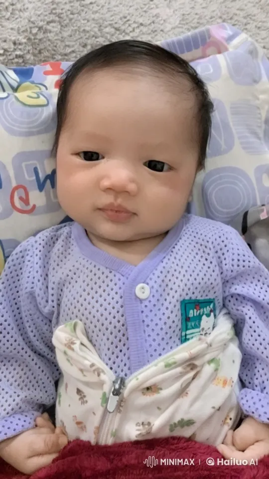 Baby Joyfully Dancing on Bed with Soft Blanket – AI Generated Video | Hailuo AI