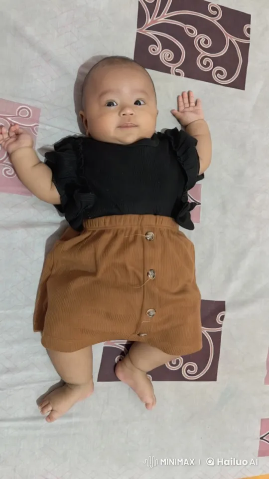 Baby Dancing Playfully on Patterned Sheet – AI Generated Video | Hailuo AI
