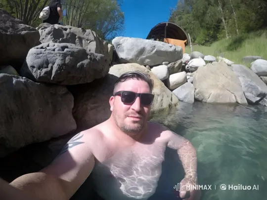 Man Relaxing in Serene Hot Spring with Natural Surroundings – AI Generated Video | Hailuo AI