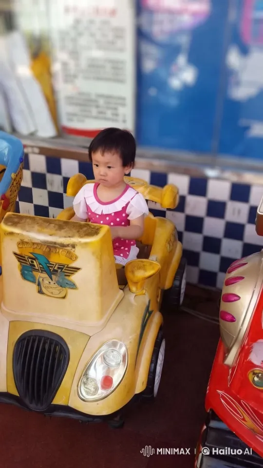 Child in Yellow Amusement Ride at Playful Park – AI Generated Video | Hailuo AI