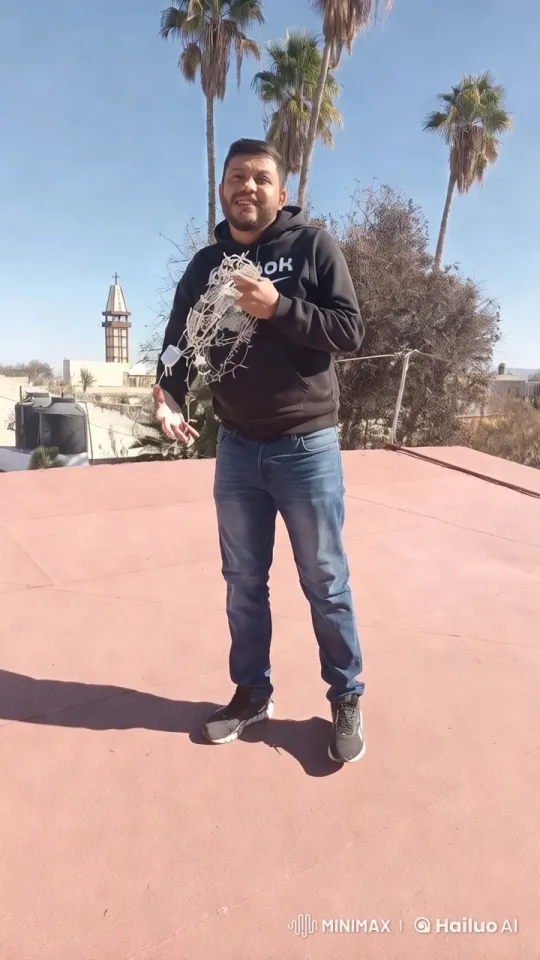 Man Arranges Lights on Rooftop Amidst Serene Cityscape – AI Generated Video | Hailuo AI