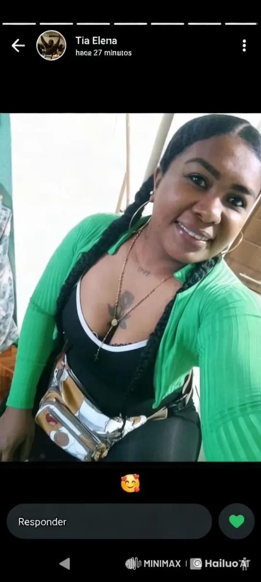 Woman in Green Cardigan Showcases Fashion in Cozy Setting – AI Generated Video | Hailuo AI