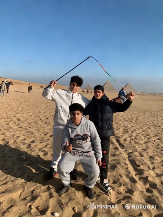 Boys Play-Fight in Desert with Pyramids Background – AI Generated Video | Hailuo AI