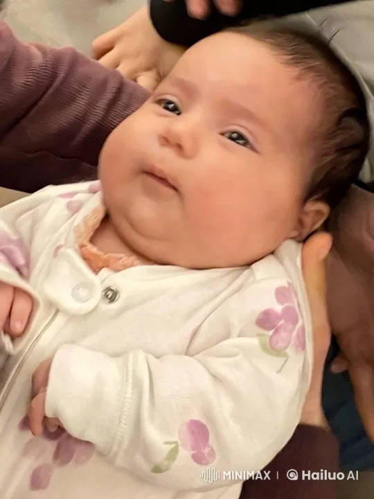 Baby in White Onesie Examined in Serene Close-Up – AI Generated Video | Hailuo AI