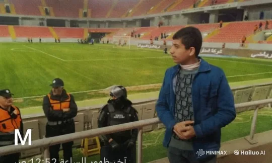 Contemplative Young Man in Empty Stadium with Security – AI Generated Video | Hailuo AI
