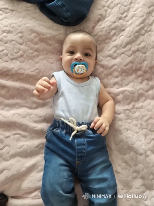 Cozy Serenity: Baby's Gentle Movements on Quilted Blanket – AI Generated Video | Hailuo AI