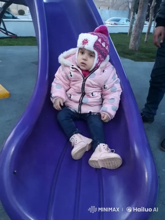 Child on Purple Slide: A Study in Curiosity – AI Generated Video | Hailuo AI