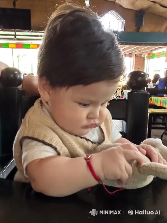 Baby Dances and Poses Kung Fu in Cozy Restaurant Setting – AI Generated Video | Hailuo AI