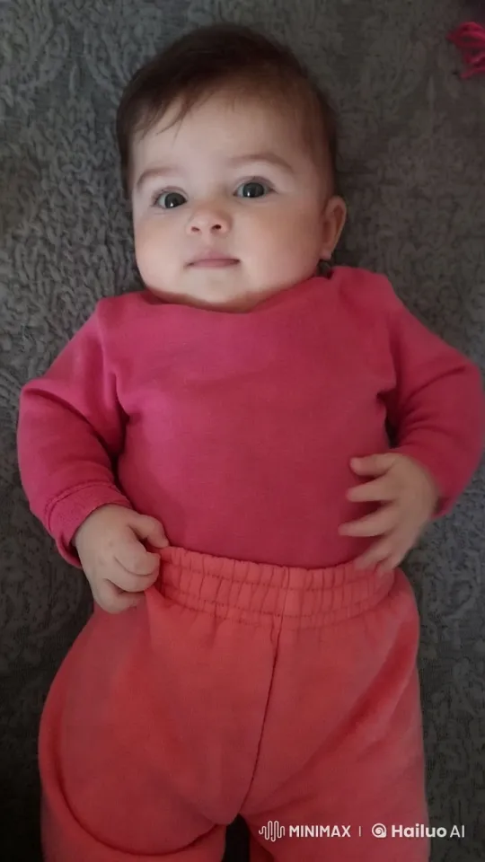 Baby on Soft Blanket in Pink Outfit – AI Generated Video | Hailuo AI