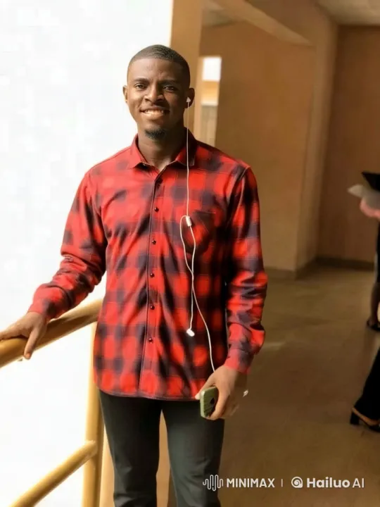 Young Man in Corridor with Smartphone - Serene Aesthetic Scene – AI Generated Video | Hailuo AI