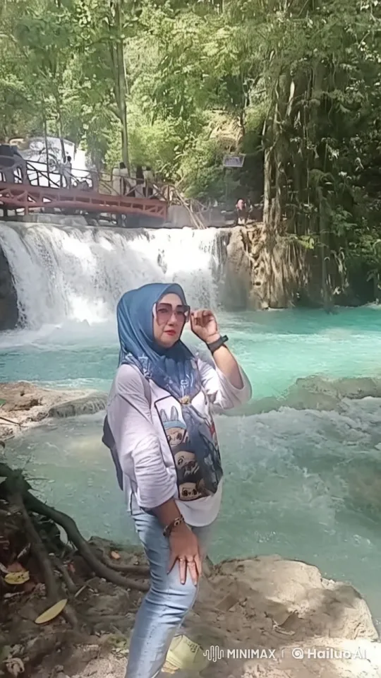 Confident Woman at Serene Waterfall Scene – AI Generated Video | Hailuo AI