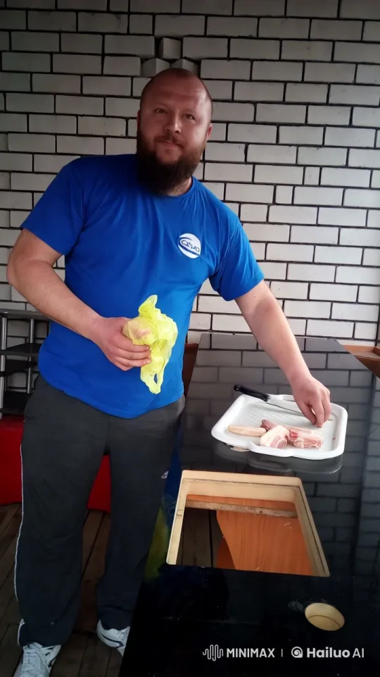 Chef Preparing Meat in a Clean Kitchen Setting – AI Generated Video | Hailuo AI