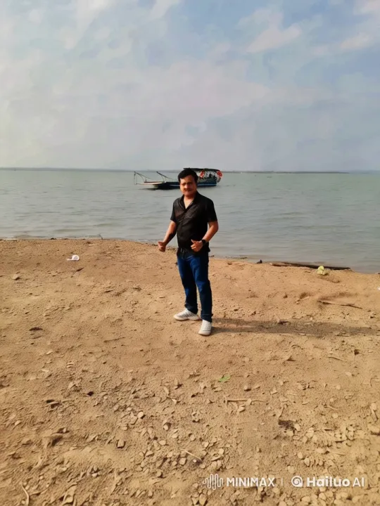 Serene Beach Scene with Man and Distant Boat – AI Generated Video | Hailuo AI