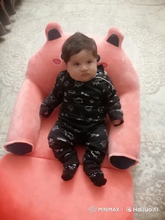 Baby Dancing and Playfully Punching in Pink Chair – AI Generated Video | Hailuo AI