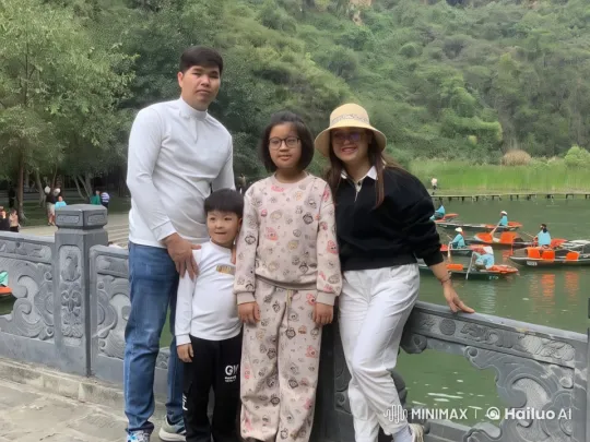 Family Performs Kungfu on Stone Bridge with Scenic Lake Background – AI Generated Video | Hailuo AI