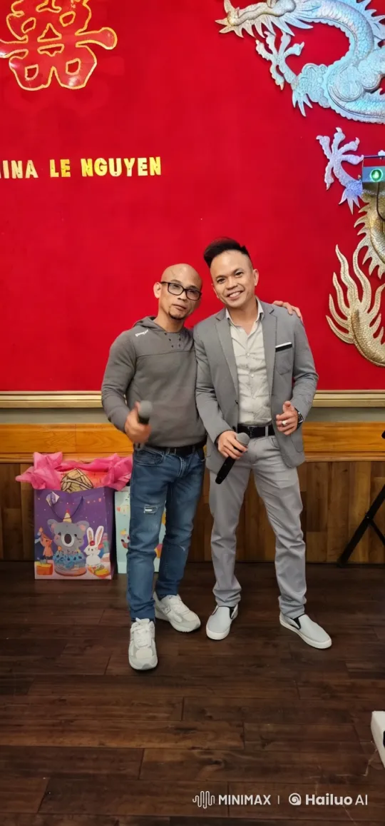 Two Men in Celebration Pose with Vibrant Red Background – AI Generated Video | Hailuo AI