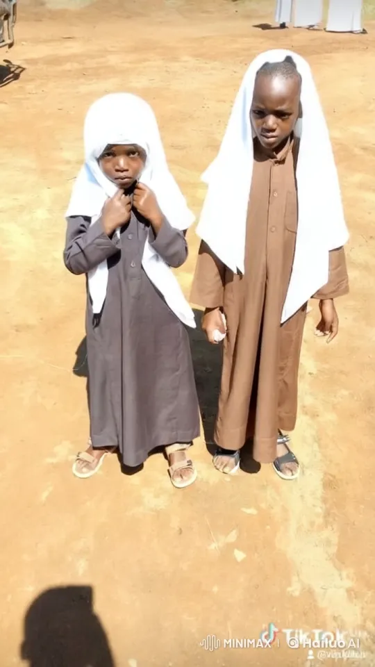 Traditional Attire of Children in Dusty Landscape – AI Generated Video | Hailuo AI