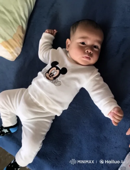 Baby Dancing Cheerfully on Blue Blanket – AI Generated Video | Hailuo AI
