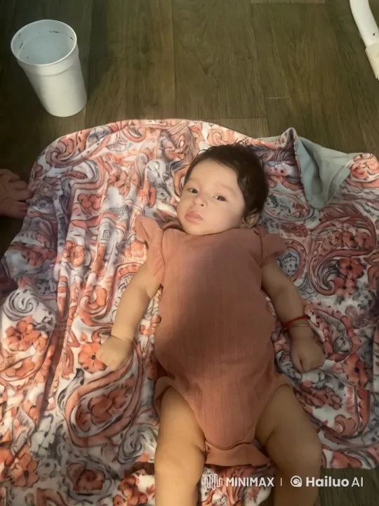 Baby Dancing Energetically on Floral Blanket – AI Generated Video | Hailuo AI