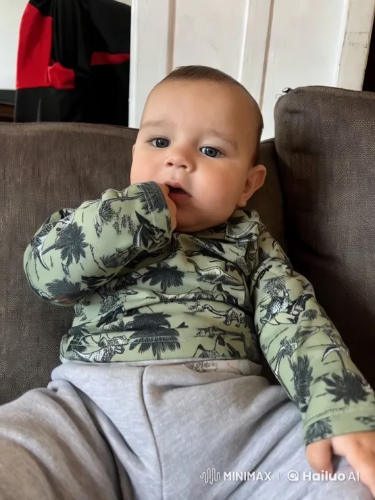 Baby Dances Joyfully on Couch in Cute Video – AI Generated Video | Hailuo AI