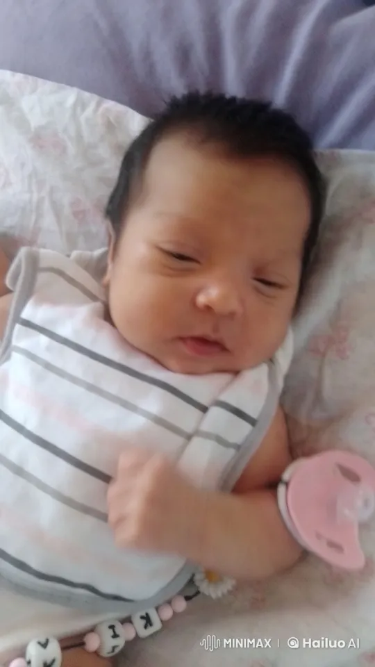Innocent Tranquility: A Newborn's Serene Moment – AI Generated Video | Hailuo AI