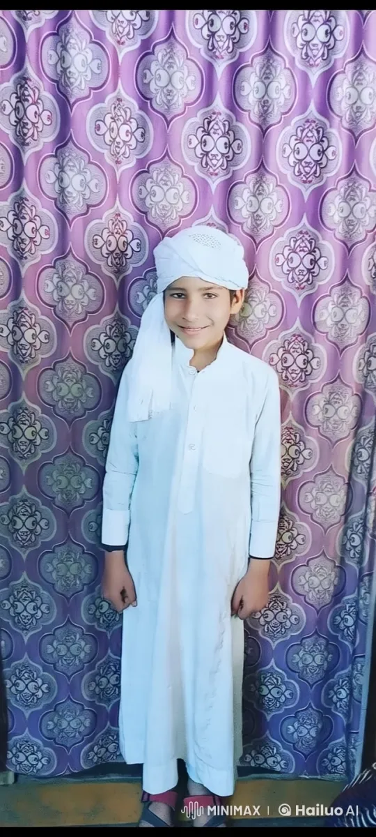 Young Boy in Traditional White Attire Before Purple Curtain – AI Generated Video | Hailuo AI